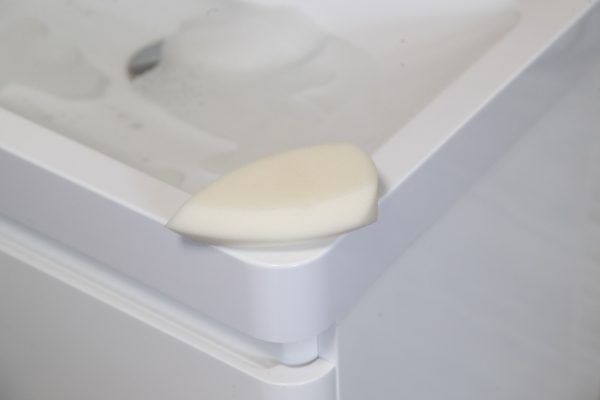 The ellie-fant teardrop shaped sponge on a sink